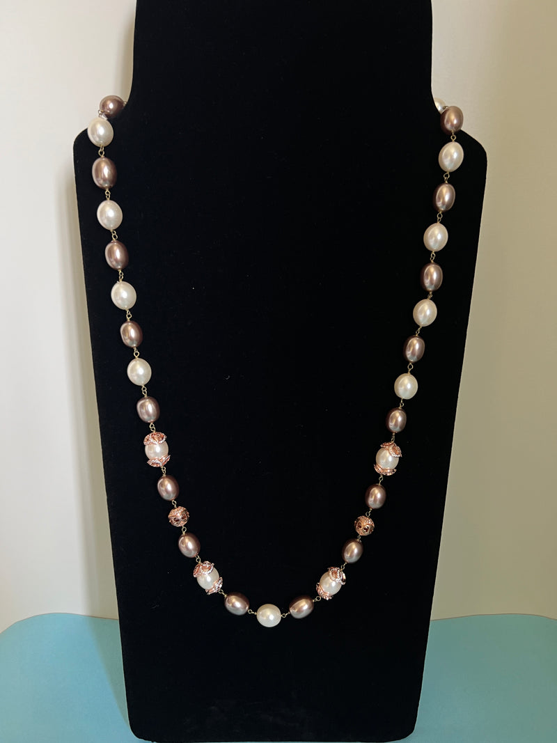 Pearl string with diamond beads